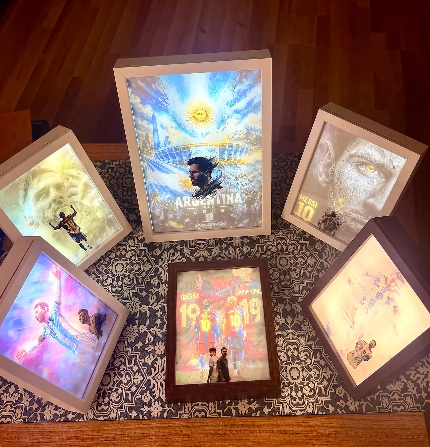 Backlit LED lightbox frames glowing with printed art